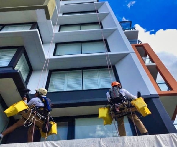 Painters abseiling down apartment building | SL8 Project | McAuliffe Painting